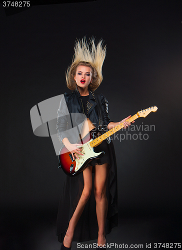 Image of The beautiful girl with guitar