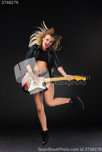 Image of The beautiful girl with guitar