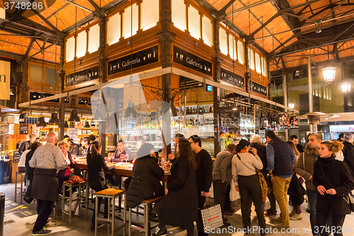 Image of People drinking and eating at San Miguel market, Madrid.