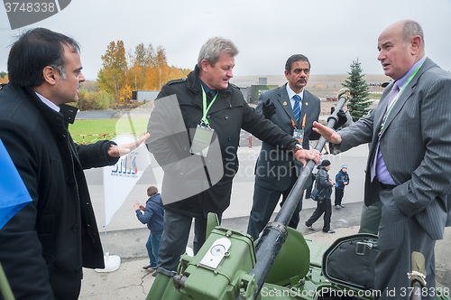 Image of Business negotiations on the tank. Russia