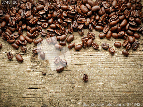 Image of coffee beans on wooden table