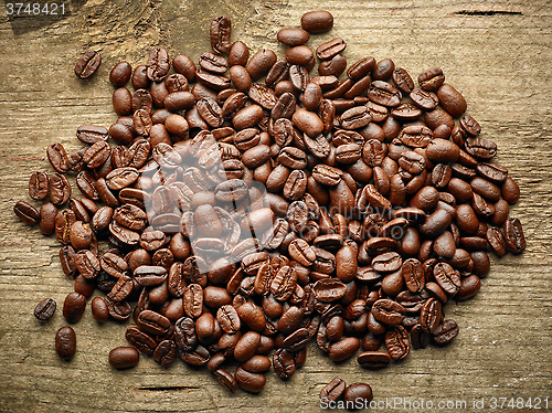 Image of Coffee beans on wooden table