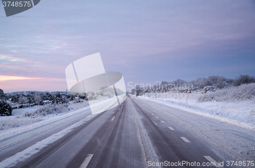 Image of Snowy asphalt country road