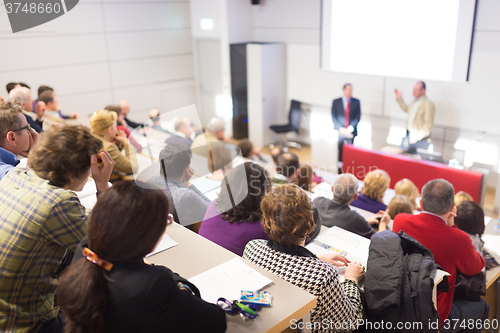 Image of Speaker at Business Conference and Presentation.