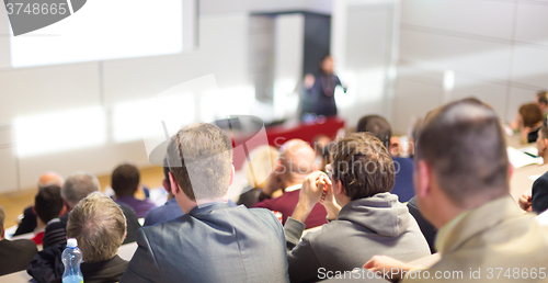 Image of Speaker at Business Conference and Presentation.