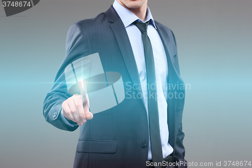 Image of business, technology, internet and networking concept - businessman pressing button with contact on virtual screens. World map