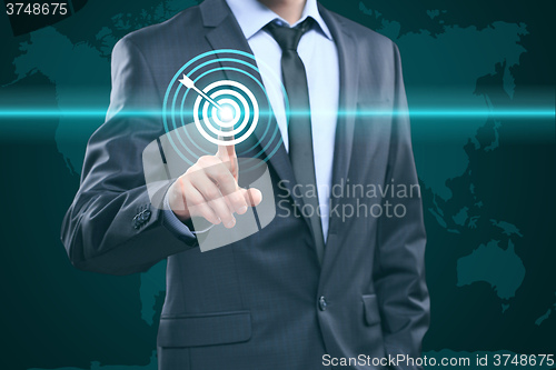 Image of business, technology, internet and networking concept - businessman pressing button with contact on virtual screens. World map