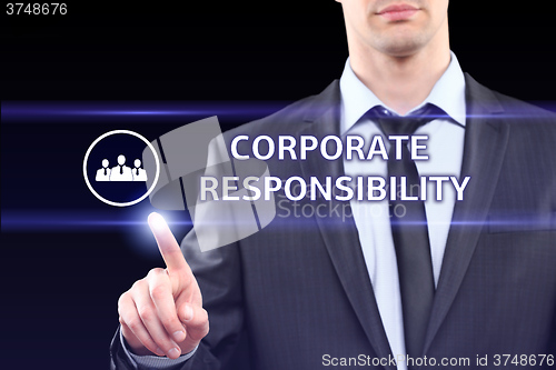 Image of business, technology and networking concept - businessman pressing corporate responsibility button on virtual screens