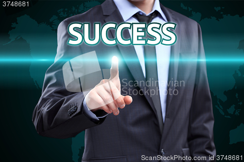 Image of businessman hand pushing success button on a touch screen interface. Business,  technology concept.