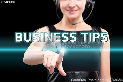 Image of businesswoman, Focus on hand pressing Business Tips button. virtual screens, technology, internet concept. 