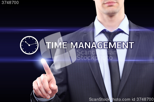 Image of business, technology, networking concept - businessman pressing time management button on virtual screens