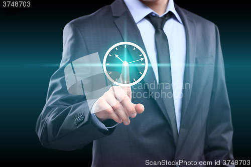 Image of Businessman hand press clock web sign time button