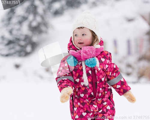 Image of little girl at snowy winter day