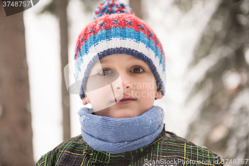 Image of little boy having fun on winter day