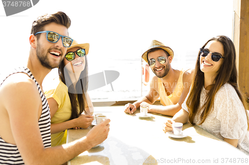 Image of Friends at the beach bar