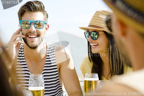 Image of Friends at the beach bar