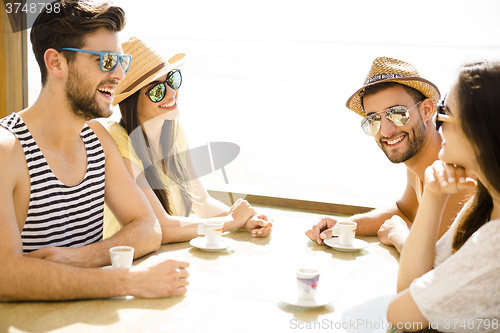 Image of Friends at the beach bar