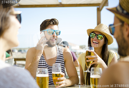 Image of Friends at the beach bar