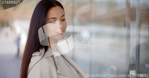 Image of Young woman eyeing an item for sale