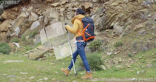 Image of Active fit young woman on a hiking trail