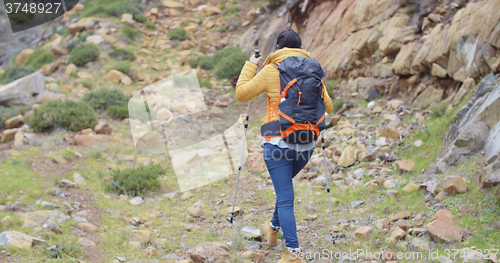 Image of Rear view of an active female hiker