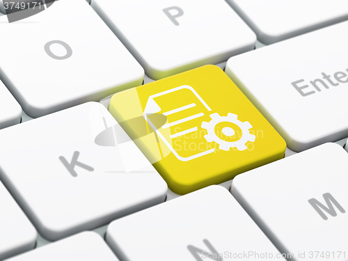 Image of Database concept: Gear on computer keyboard background