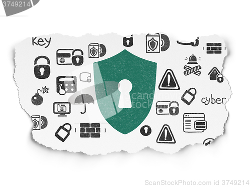 Image of Privacy concept: Shield With Keyhole on Torn Paper background