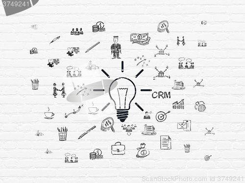 Image of Finance concept: Light Bulb on wall background