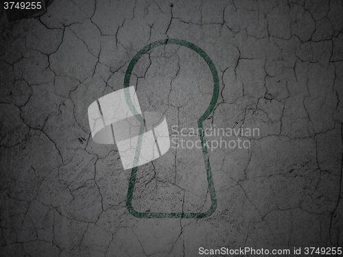 Image of Data concept: Keyhole on grunge wall background
