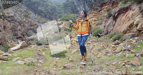Image of Healthy fit young woman outdoors backpacking