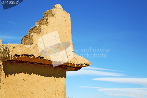 Image of brown old  construction in  africa morocco and  clouds 