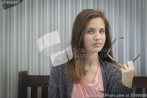 Image of Portrait of Melancholy Young Girl with Glasses