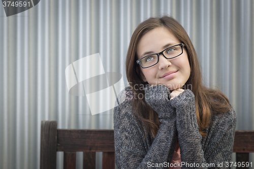 Image of Daydreaming Young Girl Looking Up and To The Side