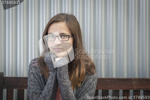 Image of Portrait of Melancholy Young Girl with Glasses