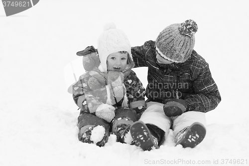 Image of group of kids having fun and play together in fresh snow