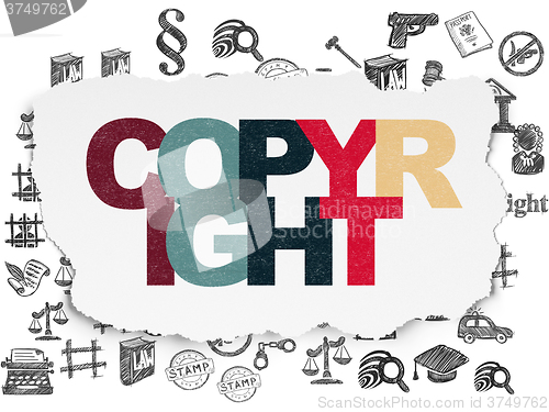 Image of Law concept: Copyright on Torn Paper background