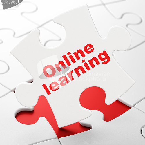 Image of Education concept: Online Learning on puzzle background