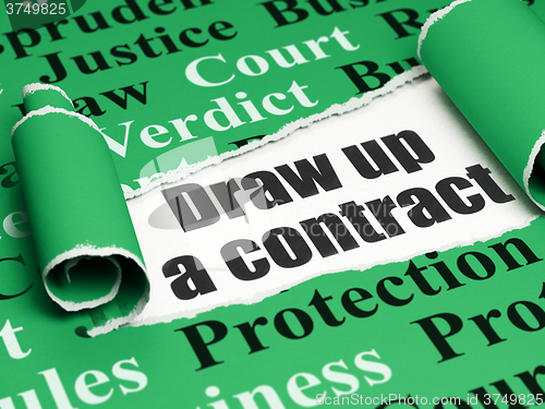 Image of Law concept: black text Draw up A contract under the piece of  torn paper