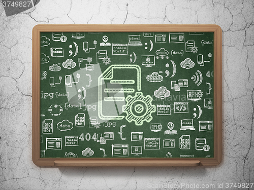 Image of Programming concept: Gear on School Board background