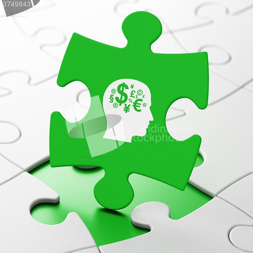 Image of Studying concept: Head With Finance Symbol on puzzle background
