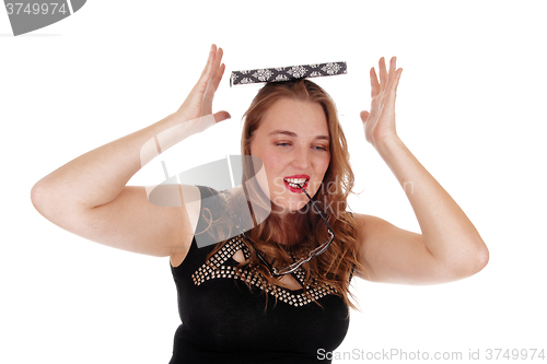 Image of Woman balancing book on her head.