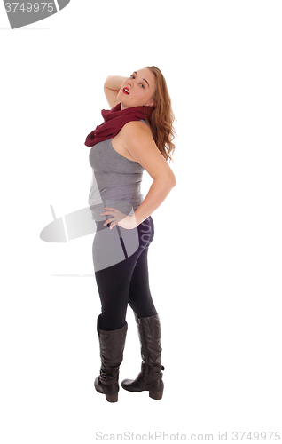 Image of Woman standing in thighs and boots.