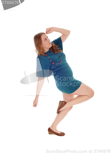 Image of Woman in dress dancing.