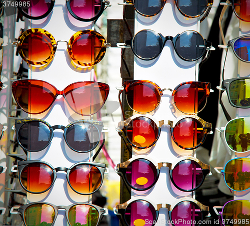 Image of in london glass and sunglasses in the light and reflex