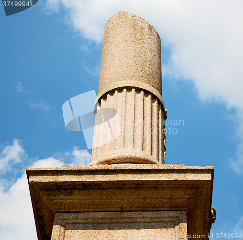 Image of old column in the cloudy sky of europe italy