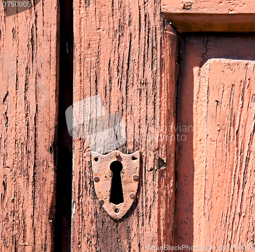 Image of door in italy old ancian wood and trasditional  texture nail