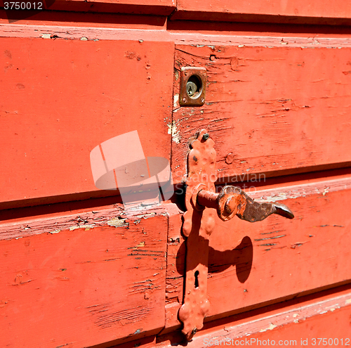 Image of door in italy old ancian wood and trasditional  texture nail