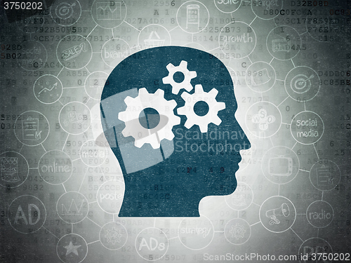 Image of Marketing concept: Head With Gears on Digital Paper background