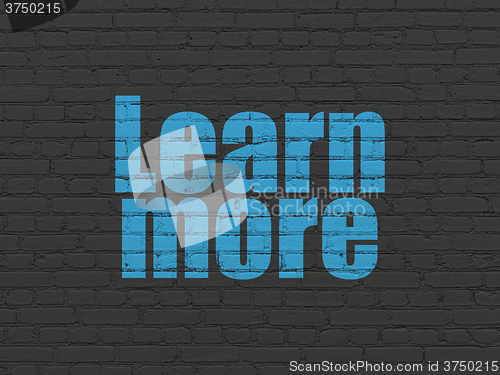 Image of Education concept: Learn More on wall background