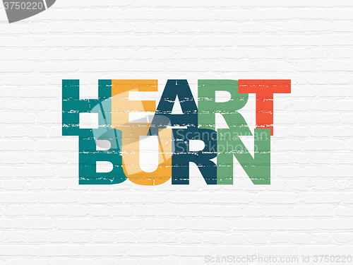 Image of Medicine concept: Heartburn on wall background